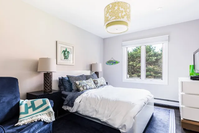 a bedroom with bed and a window