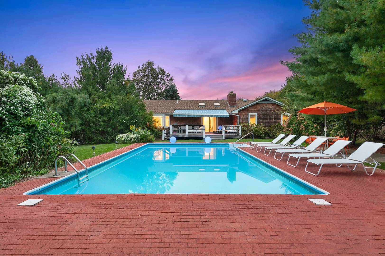 30 Lower 7 Ponds Road Water Mill, NY 11976 - Photo 3 of 32 a house with swimming pool in front of it