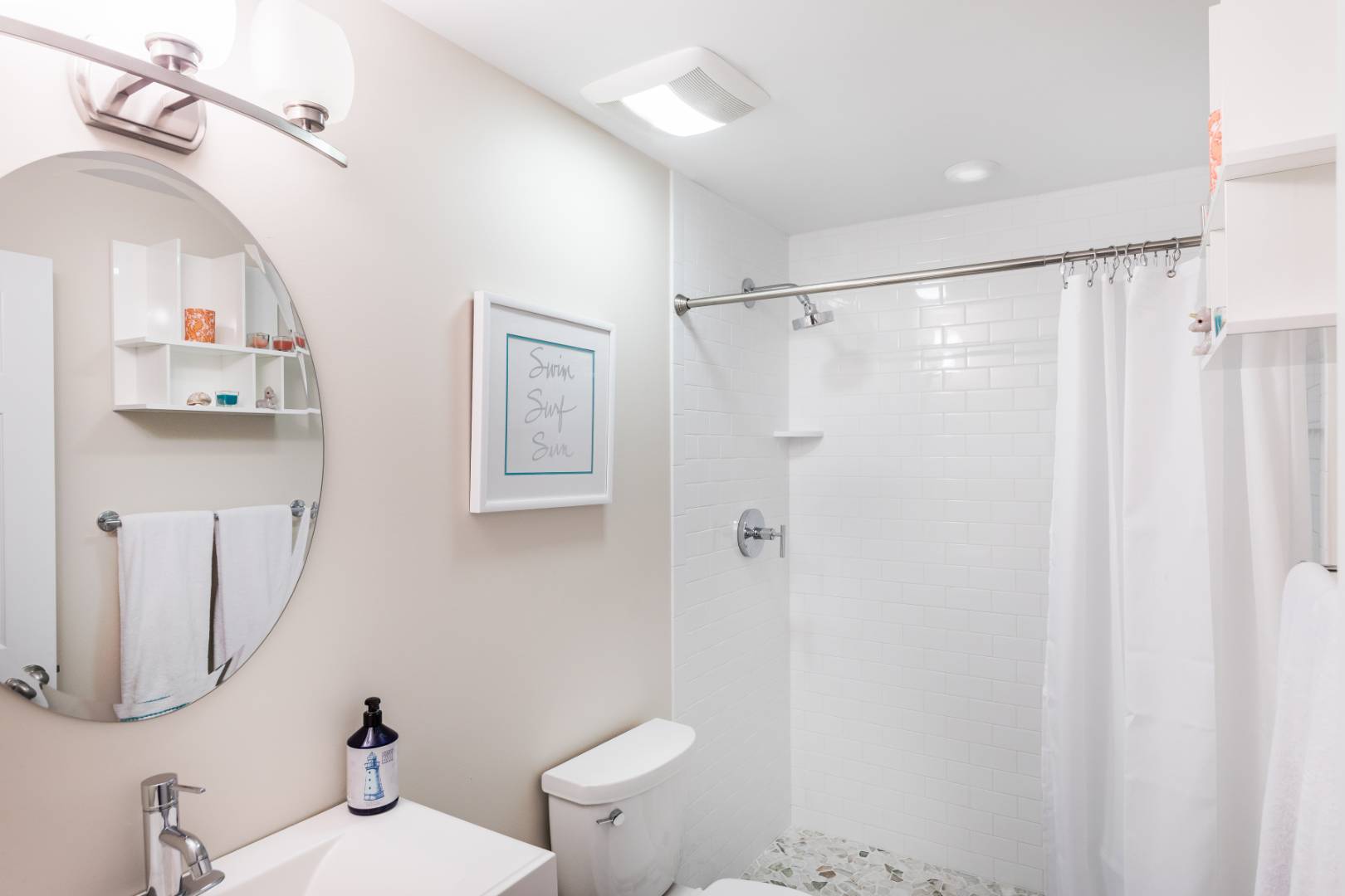 30 Lower 7 Ponds Road Water Mill, NY 11976 - Photo 28 of 32 a bathroom with a sink mirror vanity and toilet