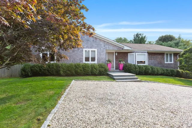 a house with garden in front of it