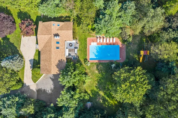 an sign that is sitting in front of flowers