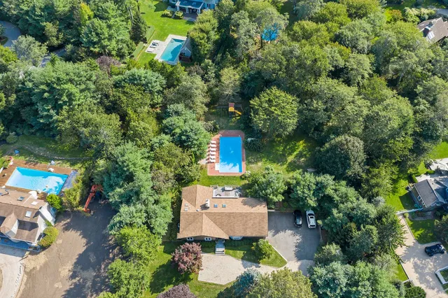 an aerial view of a house with outdoor space and street view