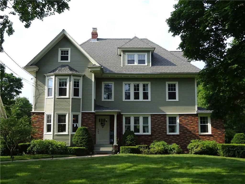 1227 Mapleton Avenue Suffield, CT 06078 - Photo 1 of 1 a front view of a house with a yard and trees