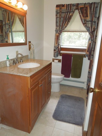294 Rangeway Road Billerica, MA 01862 - Photo 13 of 28 a bathroom with a toilet sink and mirror