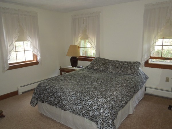 294 Rangeway Road Billerica, MA 01862 - Photo 15 of 28 a bed sitting in a bedroom next to a window
