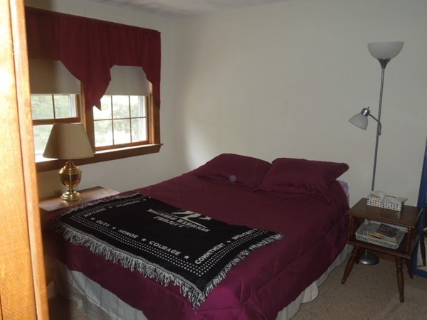 294 Rangeway Road Billerica, MA 01862 - Photo 16 of 28 a bed sitting in a bedroom next to a window