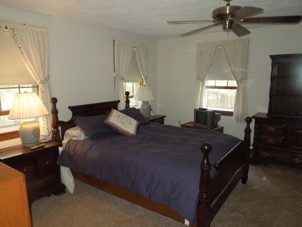 294 Rangeway Road Billerica, MA 01862 - Photo 17 of 28 a bedroom with a bed and a flat tv screen on dresser