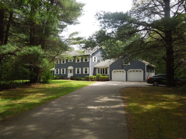 294 Rangeway Road Billerica, MA 01862 - Photo 2 of 28 a front view of a house with a garden and trees