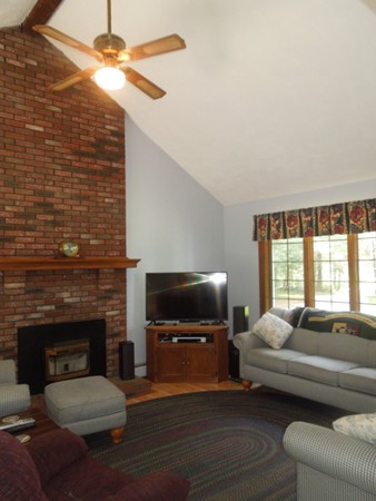 294 Rangeway Road Billerica, MA 01862 - Photo 3 of 28 a living room with furniture and a fireplace