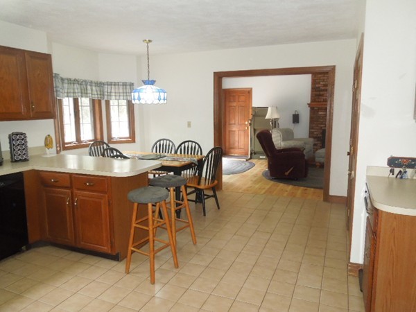 294 Rangeway Road Billerica, MA 01862 - Photo 5 of 28 a kitchen with a sink cabinets and dining table