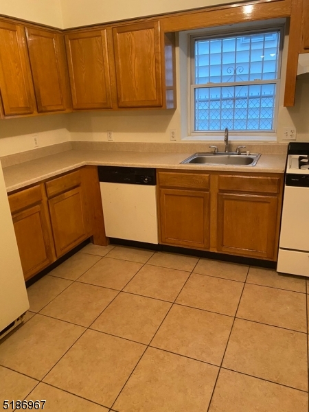 41 Wainwright Street Newark, NJ 07112 - Photo 1 of 7 a kitchen with a sink and cabinets