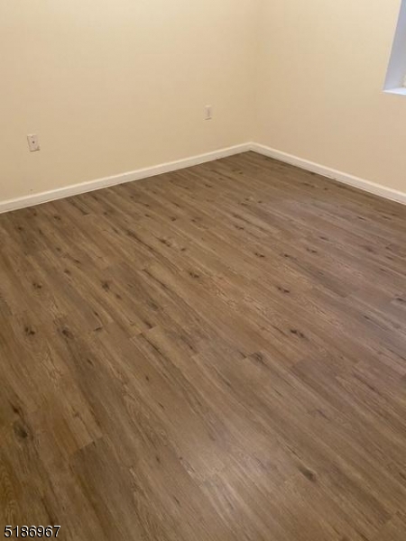 41 Wainwright Street Newark, NJ 07112 - Photo 7 of 7 wooden floor in empty room