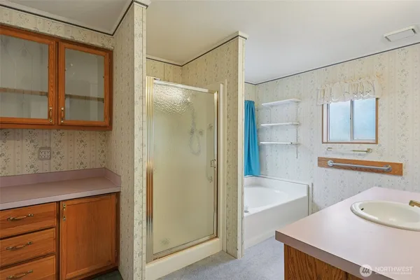 a bathroom with a sink and a mirror