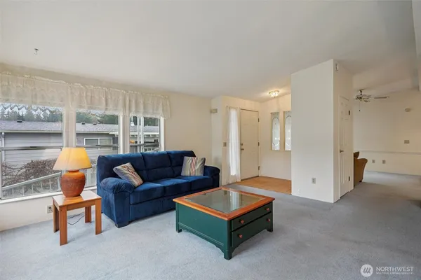 a living room with furniture and a table