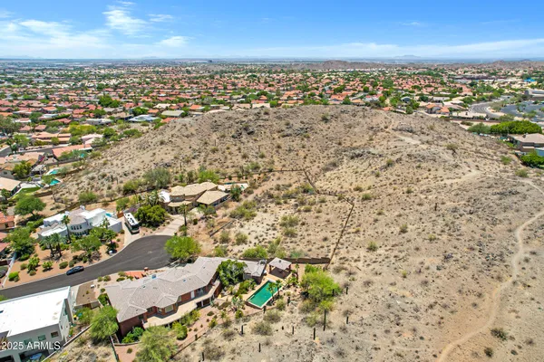 an aerial view of residential building with parking space