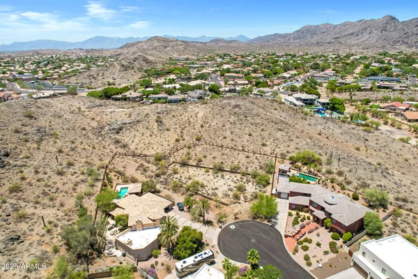 a view of a city with mountains in the background