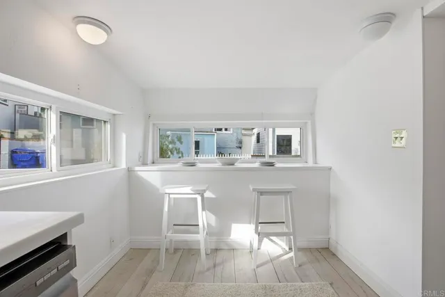 a large white bed in a white room