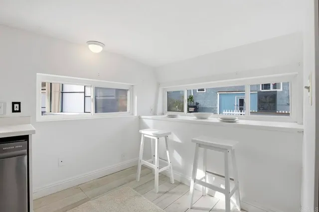 a bedroom with a bed and a potted plant