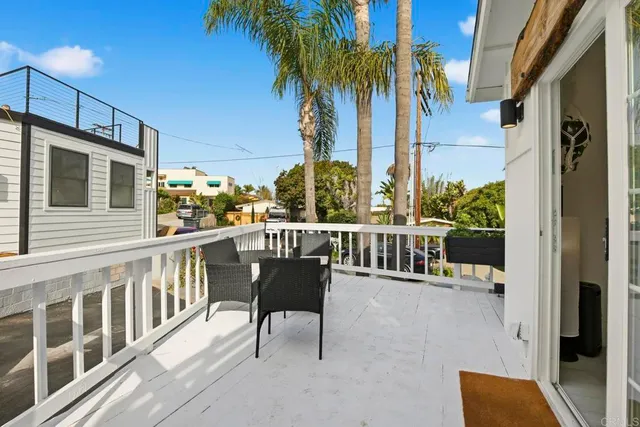 a view of white house with a large windows