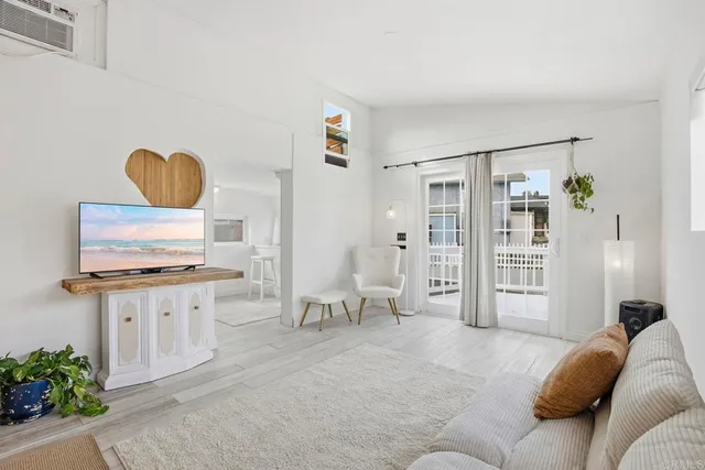 a bedroom with furniture and a chair