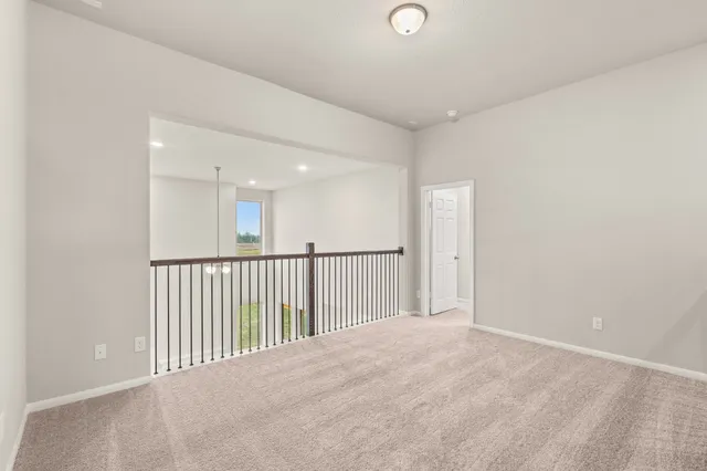 a bathroom with a tub a sink and mirrors