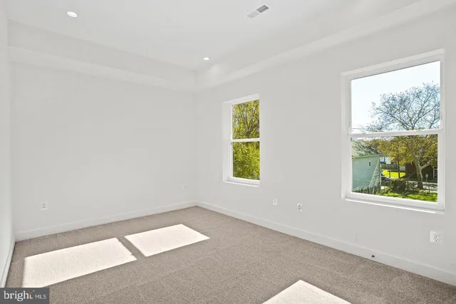 an empty room with windows