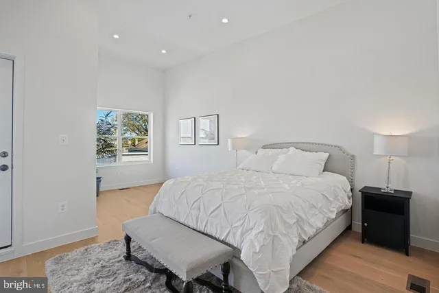 a bedroom with a bed and a couch