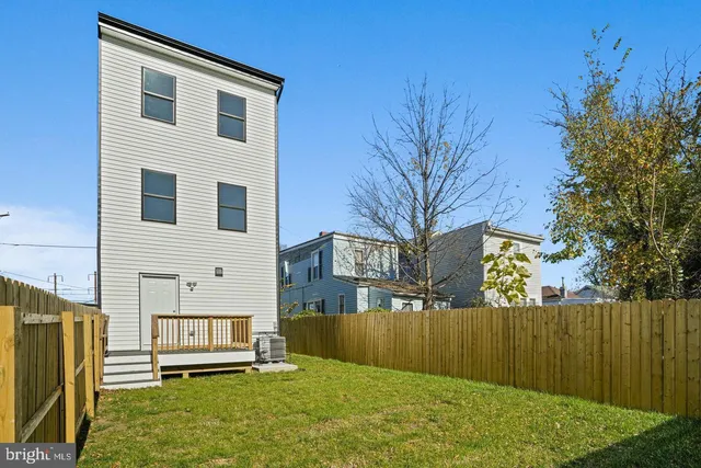 a view of house with yard