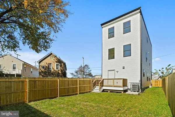 a front view of a house with a yard table and chairs