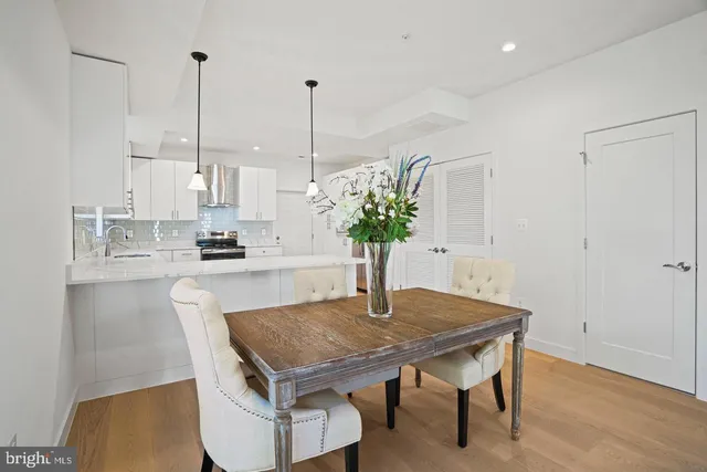 a view of kitchen island with furniture and wooden floor