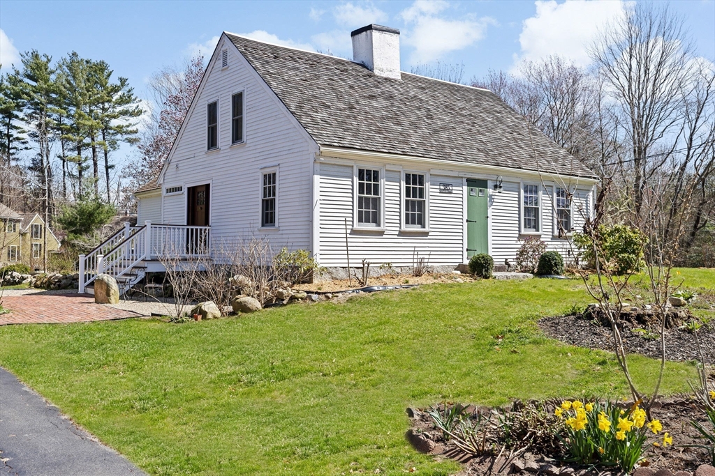 385 Whiting Street Hanover, MA 02339 - Photo 1 of 42 a front view of house with yard and outdoor seating