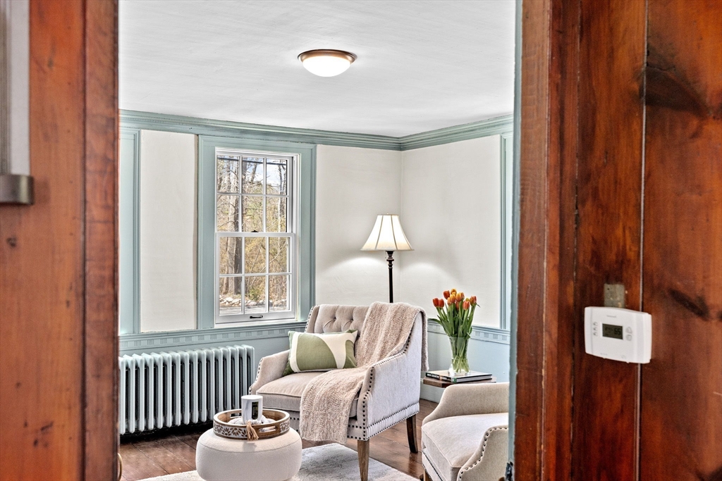 385 Whiting Street Hanover, MA 02339 - Photo 14 of 42 a living room with furniture and a window