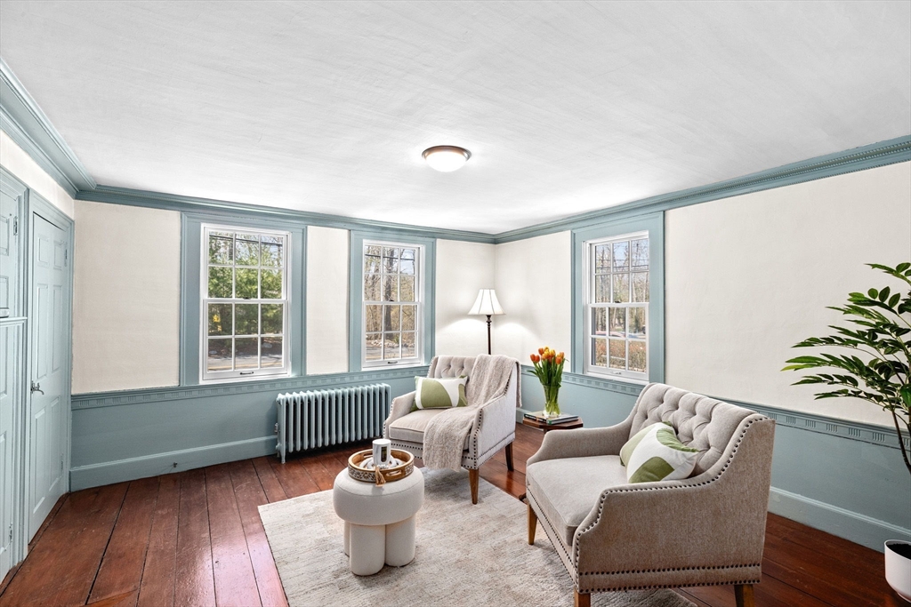 385 Whiting Street Hanover, MA 02339 - Photo 15 of 42 a living room with furniture and a window