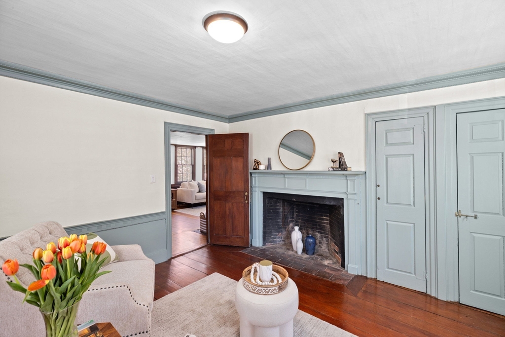385 Whiting Street Hanover, MA 02339 - Photo 17 of 42 a living room with furniture and a fireplace