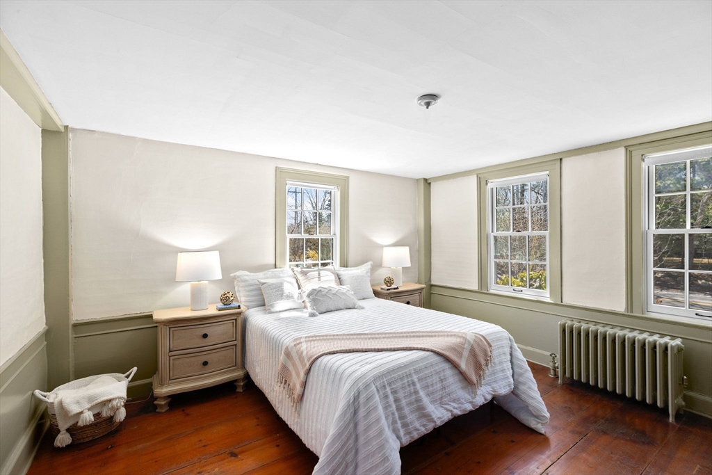 385 Whiting Street Hanover, MA 02339 - Photo 18 of 42 a bedroom with a bed and a window