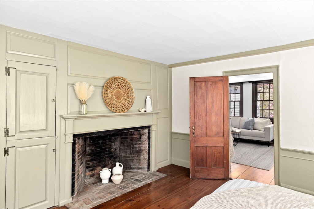 385 Whiting Street Hanover, MA 02339 - Photo 19 of 42 a living room with furniture and a fireplace