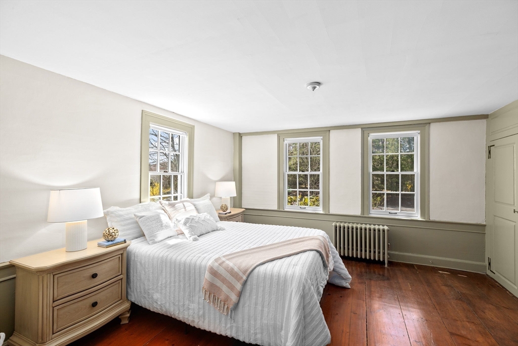 385 Whiting Street Hanover, MA 02339 - Photo 20 of 42 a bedroom with a bed and a window