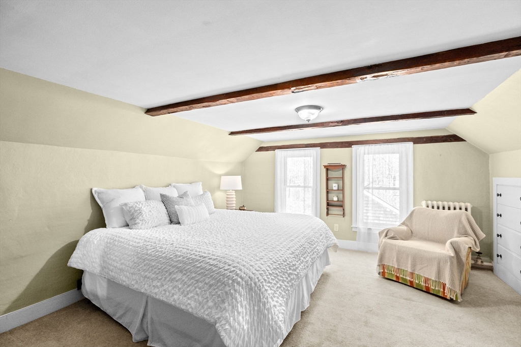 385 Whiting Street Hanover, MA 02339 - Photo 24 of 42 a bedroom with a bed and a large window