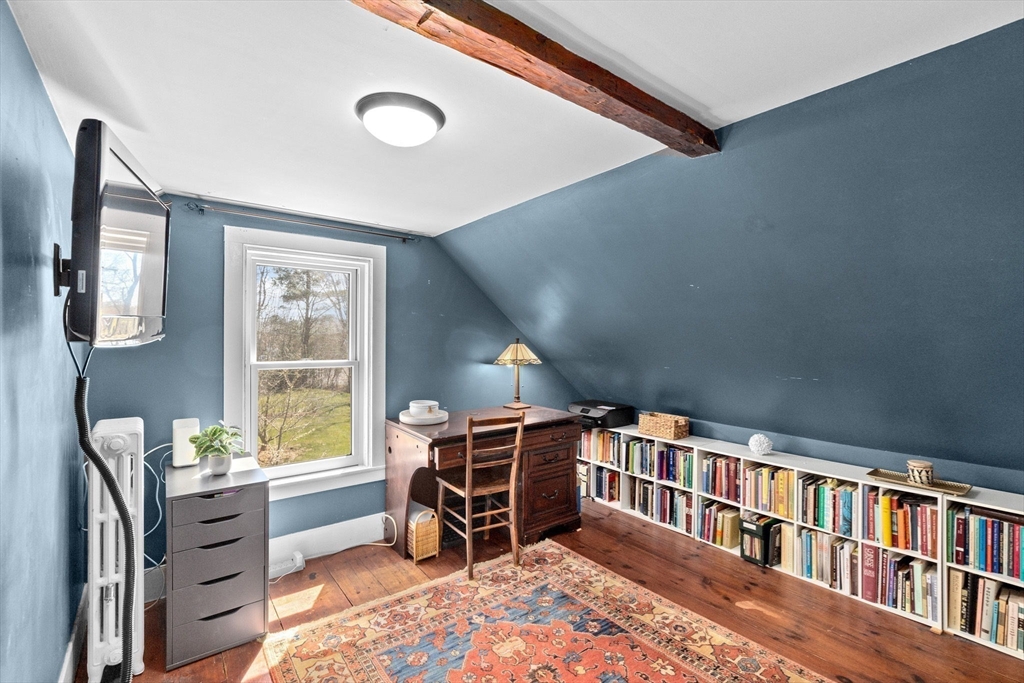 385 Whiting Street Hanover, MA 02339 - Photo 26 of 42 a bedroom with furniture closet and a window