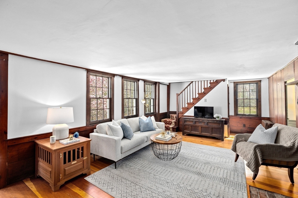 385 Whiting Street Hanover, MA 02339 - Photo 3 of 42 a living room with furniture and a large window