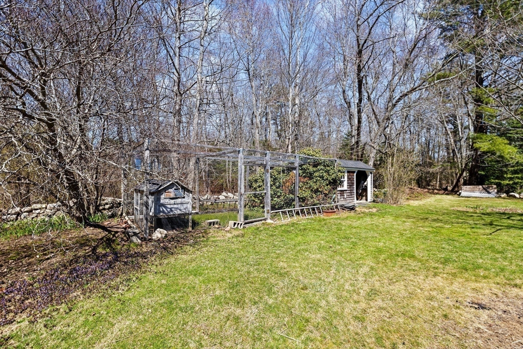 385 Whiting Street Hanover, MA 02339 - Photo 34 of 42 a view of a house with a yard