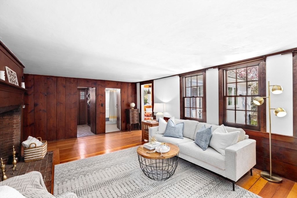 385 Whiting Street Hanover, MA 02339 - Photo 6 of 42 a living room with furniture and a floor to ceiling window
