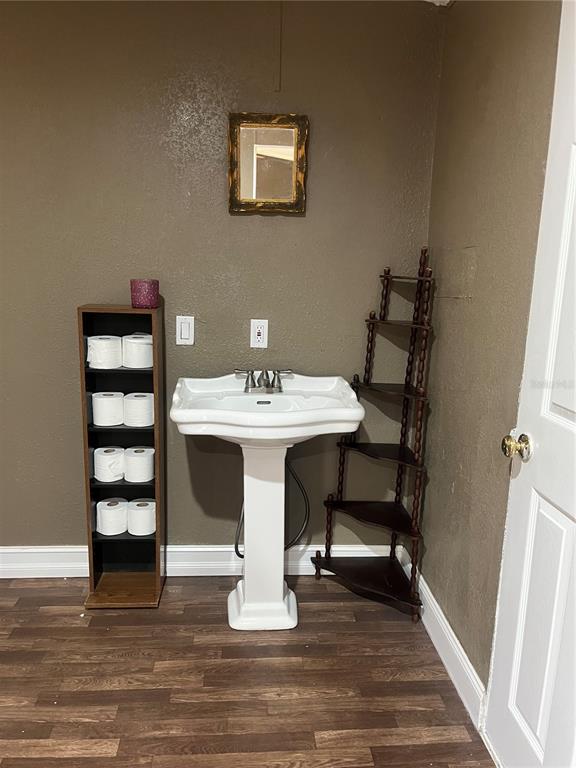 10330 Northeast 90th Street Bronson, FL 32621 - Photo 15 of 28 a dining room with furniture and wooden floor