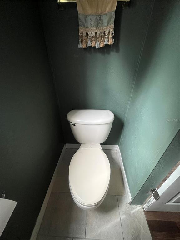 10330 Northeast 90th Street Bronson, FL 32621 - Photo 19 of 31 a bathroom with a toilet and a mirror