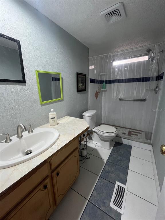 10330 Northeast 90th Street Bronson, FL 32621 - Photo 24 of 31 a bathroom with a sink toilet and mirror