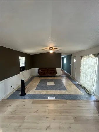 a view of an empty room and window