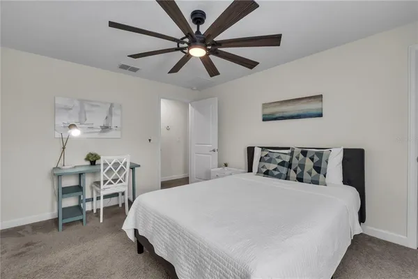a bathroom with a toilet a sink and a mirror