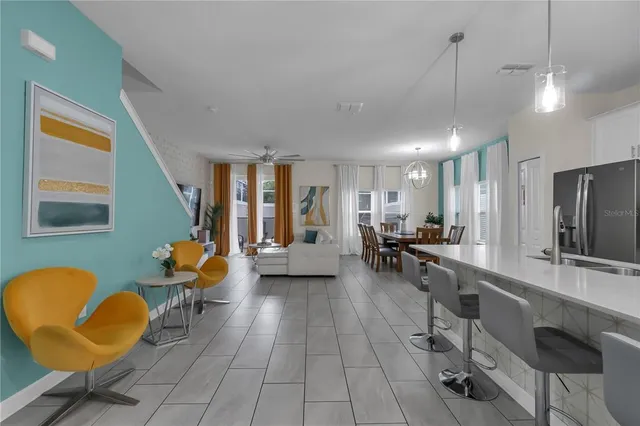 a kitchen with stainless steel appliances a refrigerator sink and cabinets