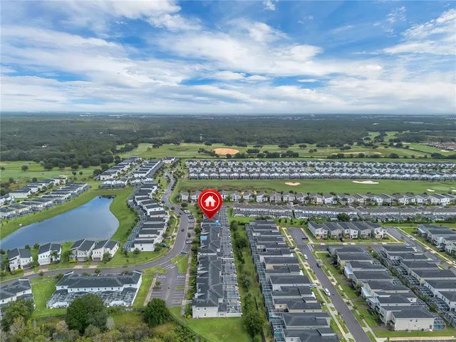 a view of a backyard with plants and a patio
