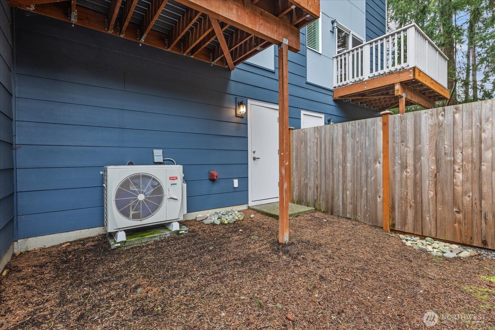23413 Edmonds Way, Unit A2 Edmonds, WA 98026 - Photo 31 of 40 a view of a backyard with a small cabin and a chair